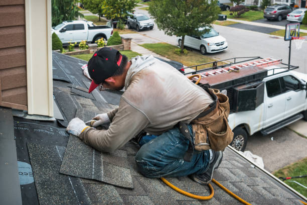 Professional Storm Damage Roof Repair technician working in Irvine, KY